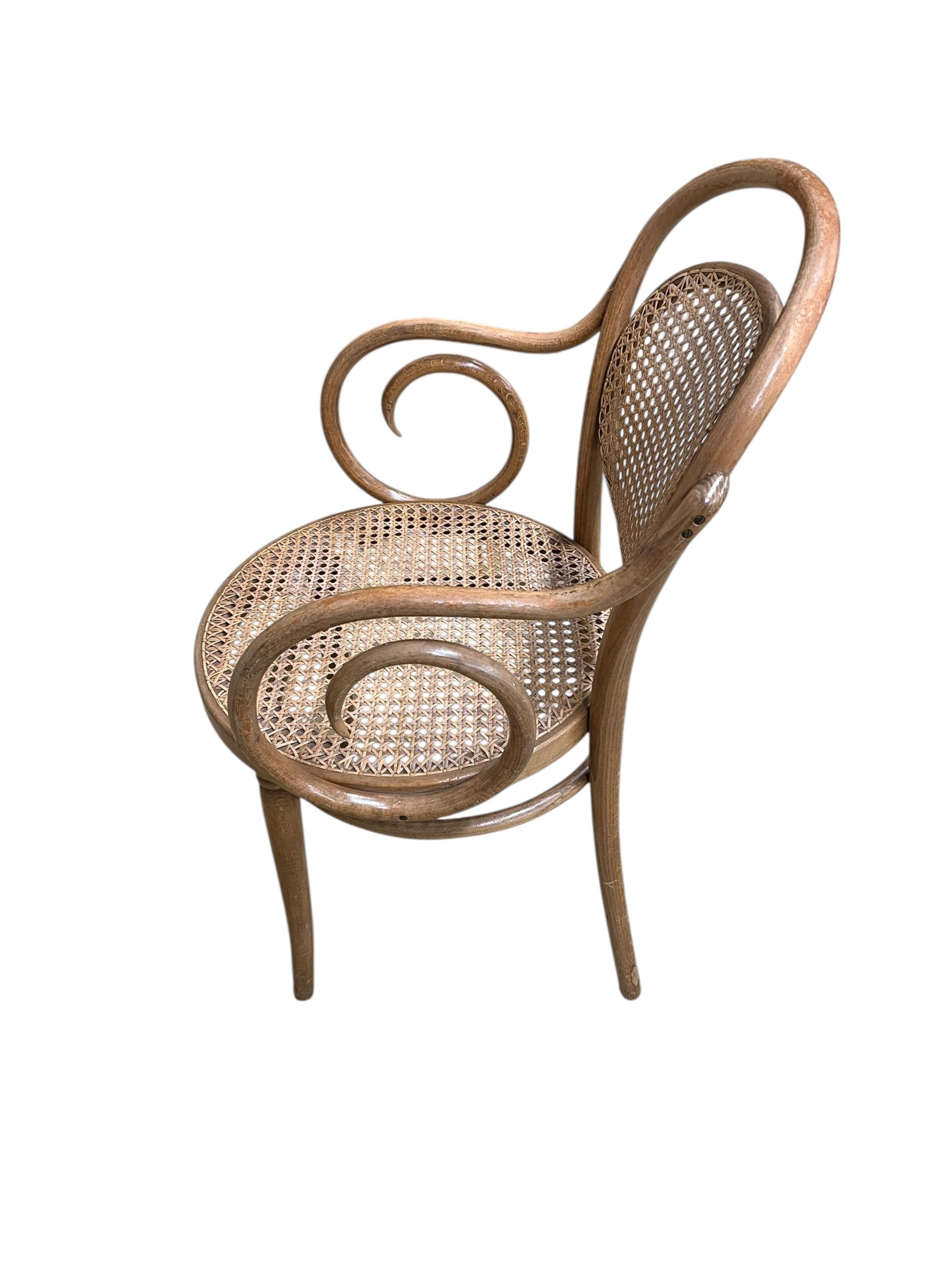 A Dinette caned beech and mahogany bentwood dining suite, comprising: dining table, width 180cm, depth 90cm, height 76cm and six elbow chairs